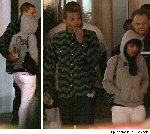 Here is Chris Brown spotted with a lady friend in Miami over the New Year's